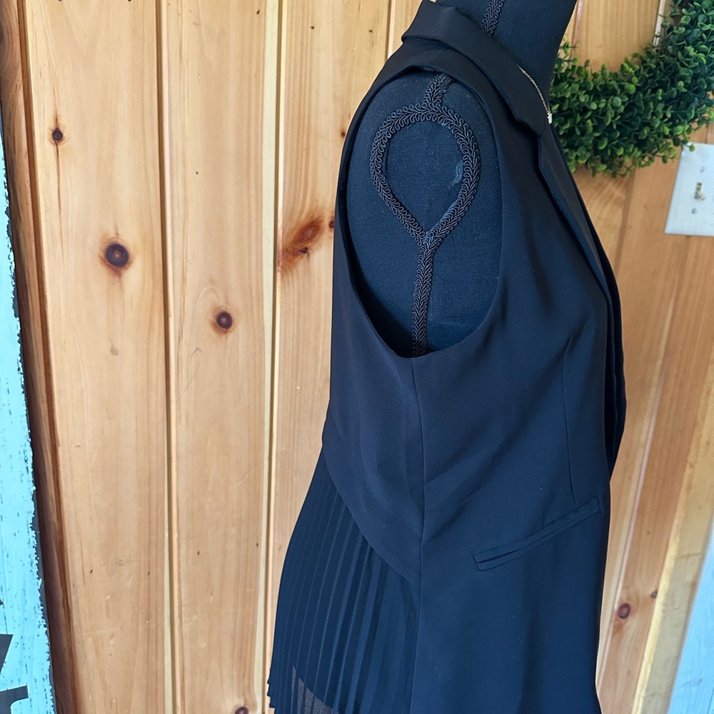Black ruffle vest